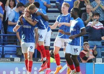 Portsmouth FC face an important contract decision as a key first-team player seeks a new deal that would represent a clear increase on his current terms. That player is Colby Bishop, who continues to be a fan favourite at Fratton Park due to his goals, physical presence, and consistent performances. Bishop remains an integral part of John Mousinho’s squad and is widely regarded as one of the club’s most influential players. Discussions between Bishop’s representatives and the club are ongoing. Those close to the talks indicate the striker believes his current contract no longer reflects his importance to the team. While no figures are being made public, the request is understood to involve a notable uplift in wages, in line with senior players at the club. Portsmouth are keen to retain Bishop and avoid unnecessary disruption, but the club is also conscious of maintaining balance within its wage structure. With interest in proven goalscorers always present across the EFL, the situation is being handled carefully. For now, Bishop remains fully committed to Pompey’s objectives and continues to focus on performances on the pitch. A resolution is expected in the coming weeks, as both sides look to secure clarity over his long-term future at Fratton Park.